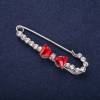 دبوس بروش فيونكة بكريستالات بيضاء وأحجار حمراء 64x18mm معدن فضي